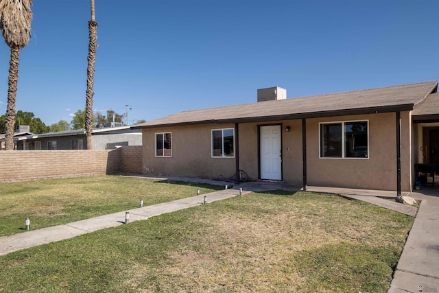 ranch-style house with stucco siding