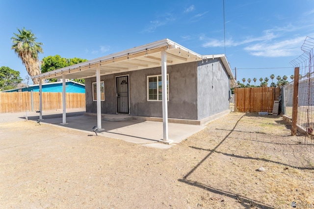 3566 W 5th St, Yuma, AZ 85364 - back of house featuring a fenced backyard, a patio, and stucco siding