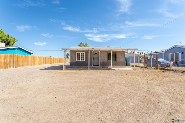 3566 W 5th St, Yuma, AZ 85364 - back of house featuring a fenced backyard, a porch, and stucco siding