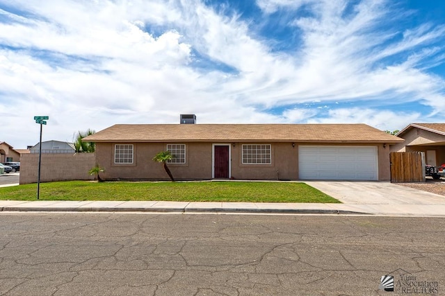 4539 W 17th St, Yuma, AZ 85364 - ranch-style house with an attached garage, concrete driveway, and stucco siding