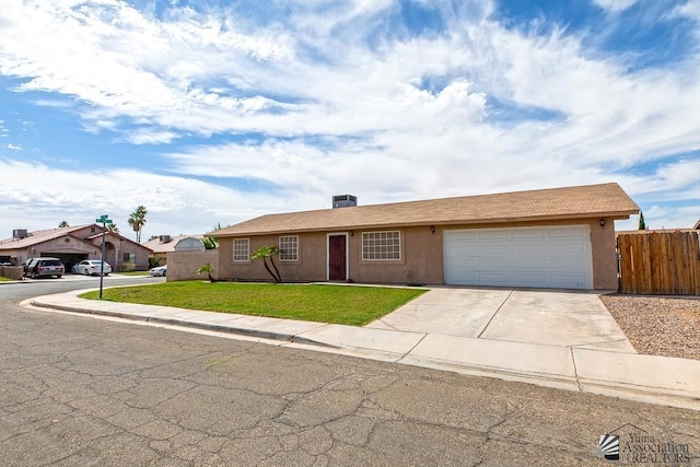 4539 W 17th St, Yuma, AZ 85364 - ranch-style house featuring driveway, a garage, and stucco siding
