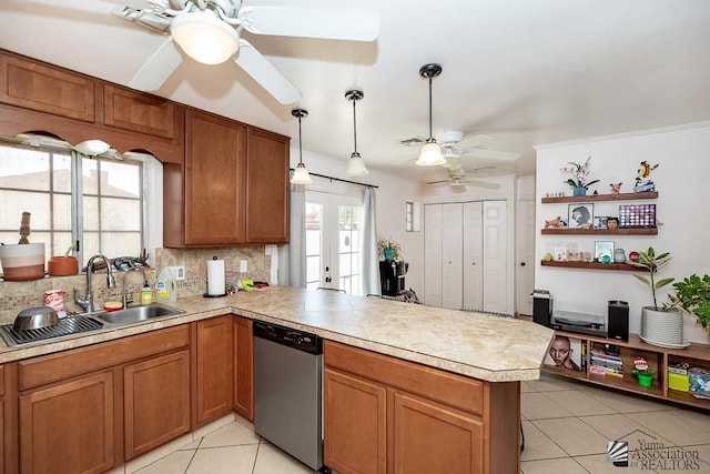 4539 W 17th St, Yuma, AZ 85364 - kitchen with stainless steel dishwasher, a ceiling fan, a peninsula, and light tile patterned floors
