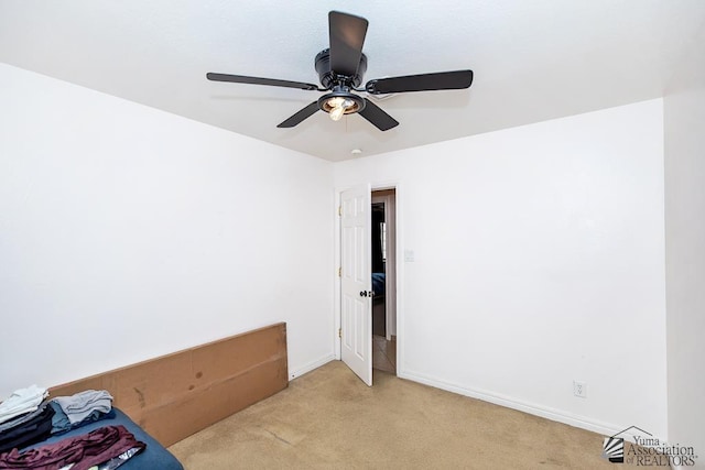 4539 W 17th St, Yuma, AZ 85364 - unfurnished bedroom featuring light colored carpet, a ceiling fan, and baseboards