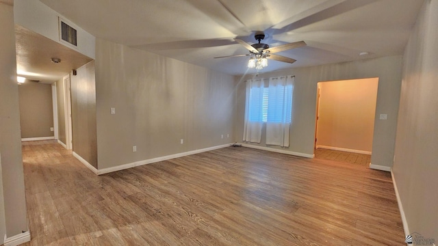 1350 S 6th Ave, Yuma, AZ 85364 - empty room featuring a ceiling fan and wood finished floors