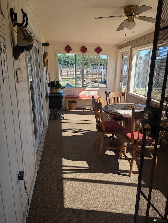 sunroom / solarium with ceiling fan