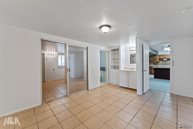 3186 S Elm St, Yuma, AZ 85364 - unfurnished bedroom featuring light tile patterned floors and a closet