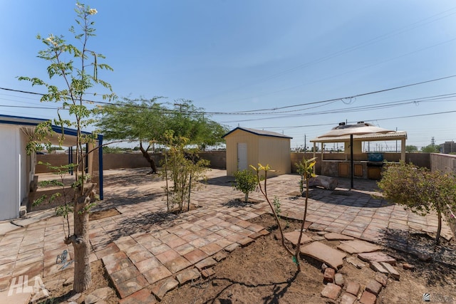 3186 S Elm St, Yuma, AZ 85364 - fenced backyard with a patio area, a gazebo, and a shed