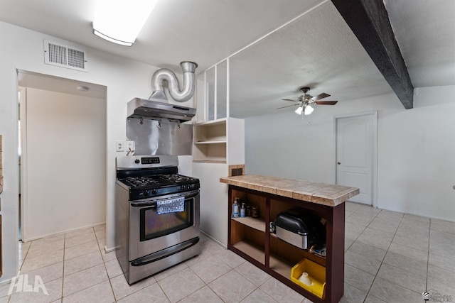 3186 S Elm St, Yuma, AZ 85364 - kitchen featuring gas stove, open shelves, a peninsula, wall chimney exhaust hood, and light tile patterned floors
