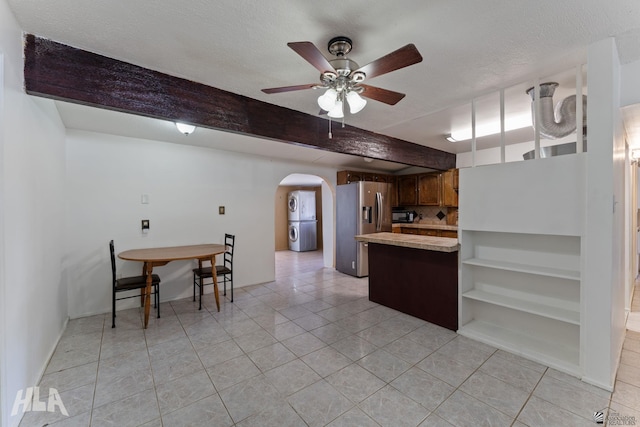 3186 S Elm St, Yuma, AZ 85364 - kitchen with stainless steel refrigerator with ice dispenser, arched walkways, a peninsula, light countertops, and a ceiling fan