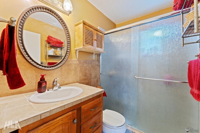 3186 S Elm St, Yuma, AZ 85364 - full bathroom with a shower stall, vanity, and tile walls