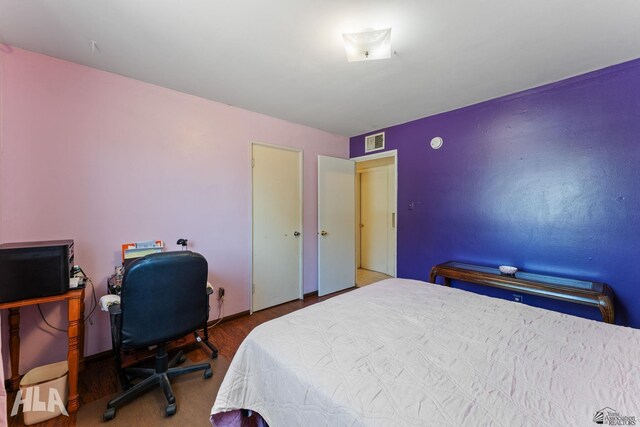3186 S Elm St, Yuma, AZ 85364 - bedroom with wood finished floors and a desk
