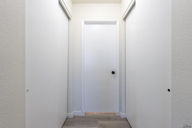 1986 S 47th Ave, Yuma, AZ 85364 - corridor with light wood finished floors and baseboards