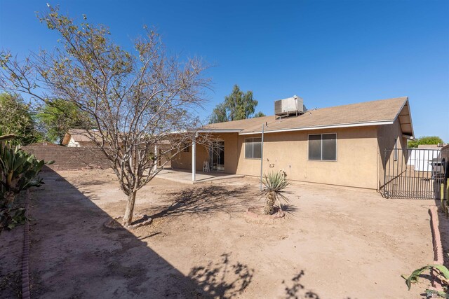 1986 S 47th Ave, Yuma, AZ 85364 - rear view of property featuring central AC, stucco siding, a patio area, and roof with shingles