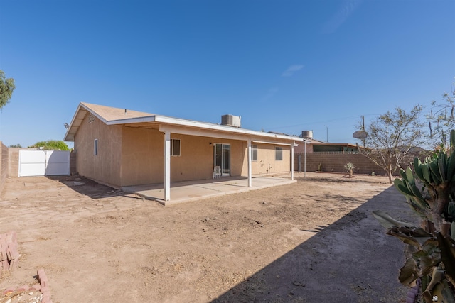 1986 S 47th Ave, Yuma, AZ 85364 - rear view of house with a fenced backyard and a patio area