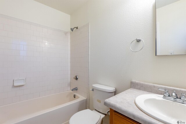 1986 S 47th Ave, Yuma, AZ 85364 - bathroom featuring toilet, vanity, and washtub / shower combination
