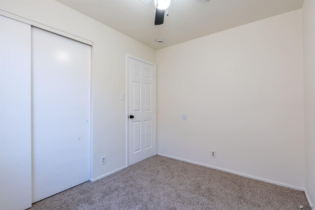 1986 S 47th Ave, Yuma, AZ 85364 - unfurnished bedroom with carpet flooring, a closet, baseboards, and ceiling fan