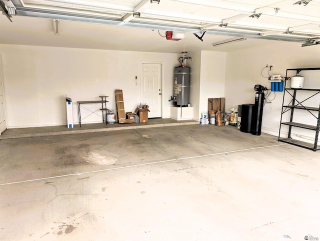 garage with secured water heater and a garage door opener