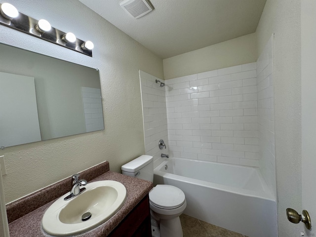 full bath featuring visible vents, vanity, a textured wall, toilet, and  shower combination