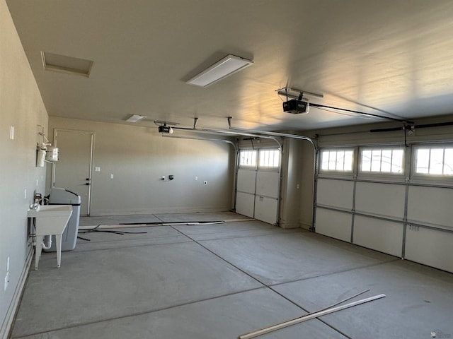 garage with sink and a garage door opener