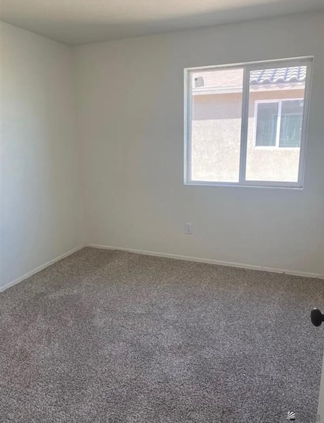 7903 E 46th Ln, Yuma, AZ 85365 - carpeted empty room with baseboards