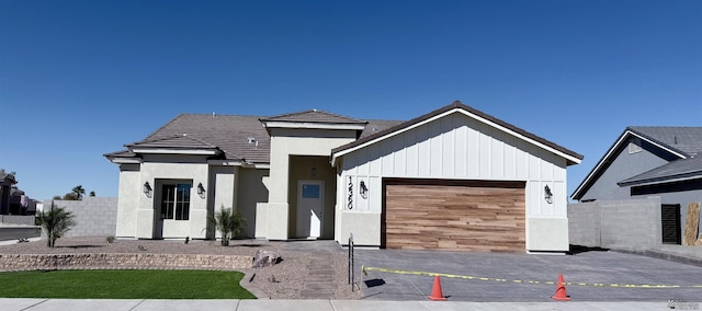 12360 E Calle Ln, Primera, Yuma, AZ 85367 - view of front of property featuring stucco siding, a garage, and fence