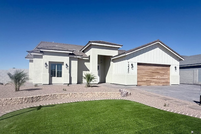 12360 E Calle Ln, Primera, Yuma, AZ 85367 - view of front of house with stucco siding, an attached garage, a tile roof, and a front lawn