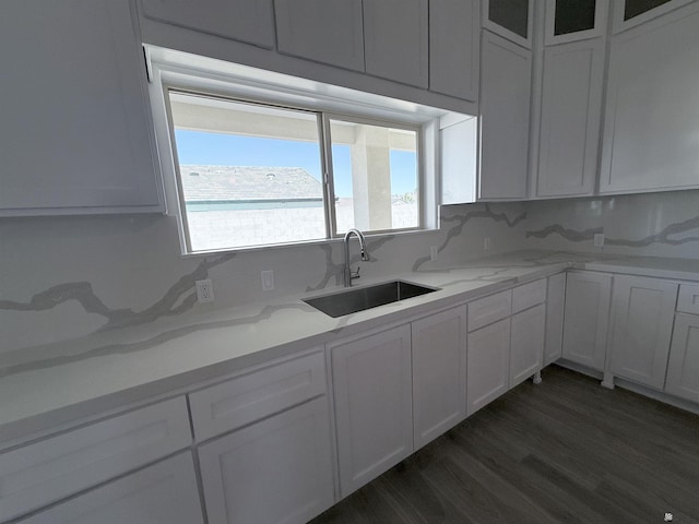12360 E Calle Ln, Primera, Yuma, AZ 85367 - kitchen featuring a sink, backsplash, white cabinets, and light stone countertops