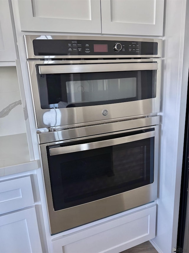 12360 E Calle Ln, Primera, Yuma, AZ 85367 - details with white cabinets and stainless steel double oven