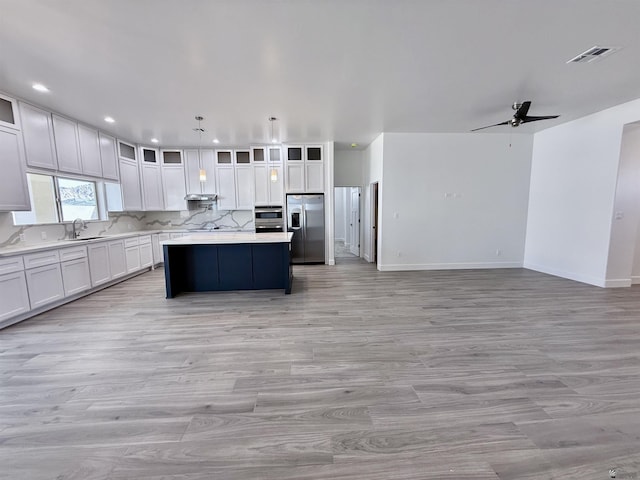 12360 E Calle Ln, Primera, Yuma, AZ 85367 - kitchen with light countertops, visible vents, stainless steel fridge with ice dispenser, and a center island