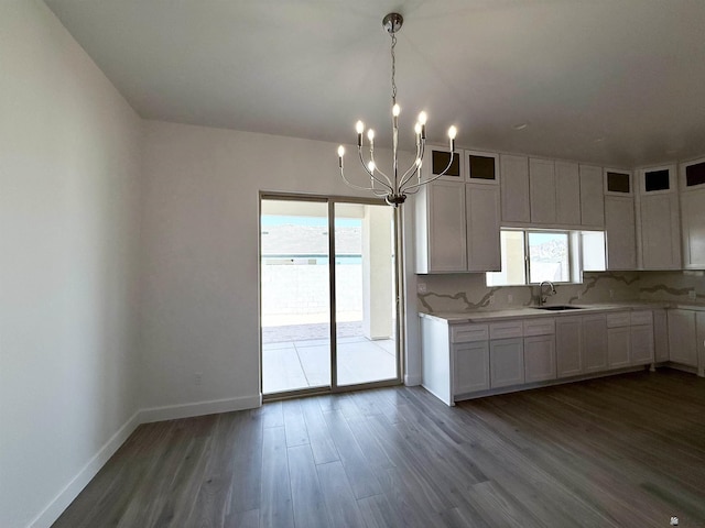 12360 E Calle Ln, Primera, Yuma, AZ 85367 - kitchen with dark wood-style flooring, baseboards, a chandelier, and a wealth of natural light