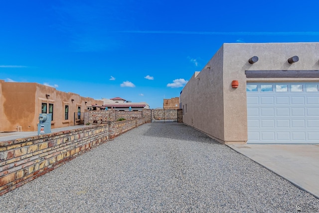 14326 E 51st St, Yuma, AZ 85367 - view of home's exterior featuring fence and stucco siding