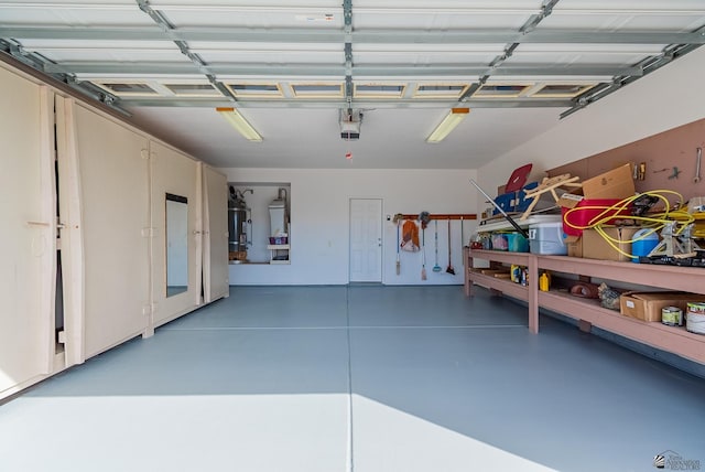 14326 E 51st St, Yuma, AZ 85367 - garage with a garage door opener and water heater