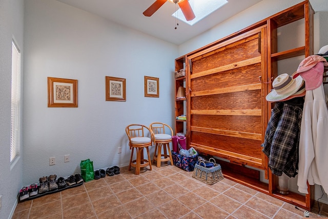 14326 E 51st St, Yuma, AZ 85367 - mudroom featuring ceiling fan, a skylight, baseboards, and tile patterned flooring