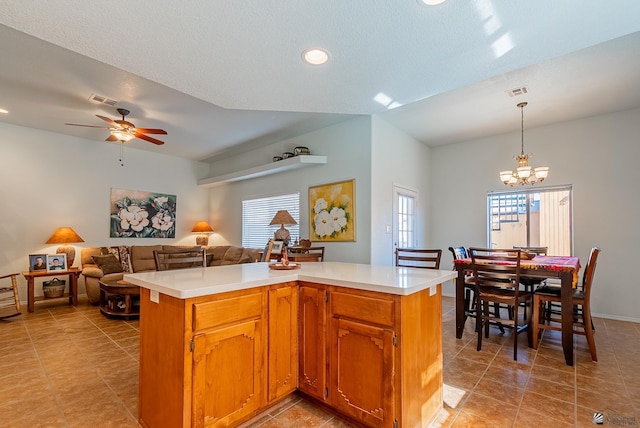 14326 E 51st St, Yuma, AZ 85367 - kitchen featuring light countertops, open floor plan, visible vents, and ceiling fan with notable chandelier