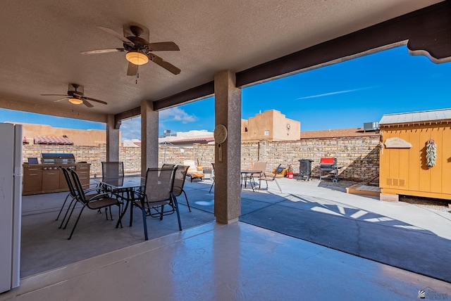 14326 E 51st St, Yuma, AZ 85367 - view of patio with a fenced backyard, a ceiling fan, and outdoor dining area