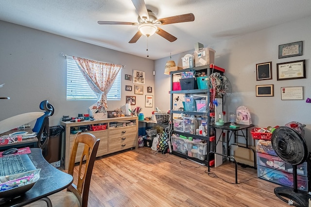 office space featuring a ceiling fan and wood finished floors