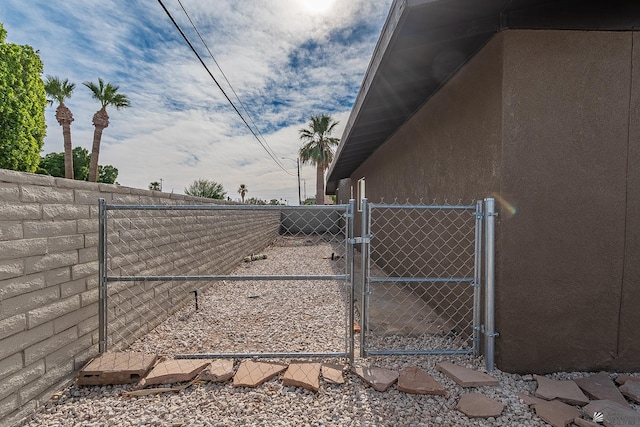 view of gate featuring fence