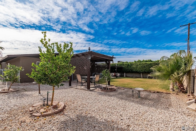 view of yard with a fenced backyard, a pergola, and a patio area