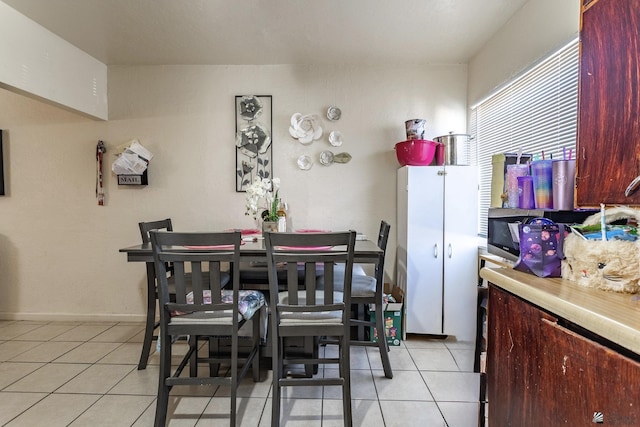 1127 S 13th Ave, Yuma, AZ 85364 - dining area with light tile patterned flooring and baseboards