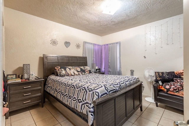 1127 S 13th Ave, Yuma, AZ 85364 - bedroom with a textured ceiling, light tile patterned floors, and a textured wall