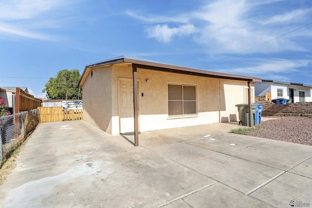 1127 S 13th Ave, Yuma, AZ 85364 - back of house with stucco siding and a patio area