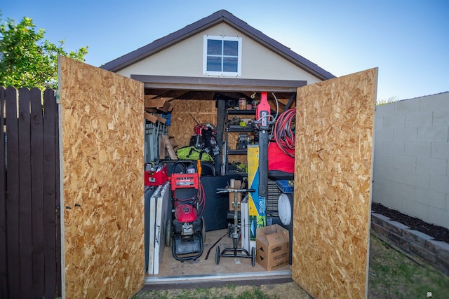view of outbuilding with fence