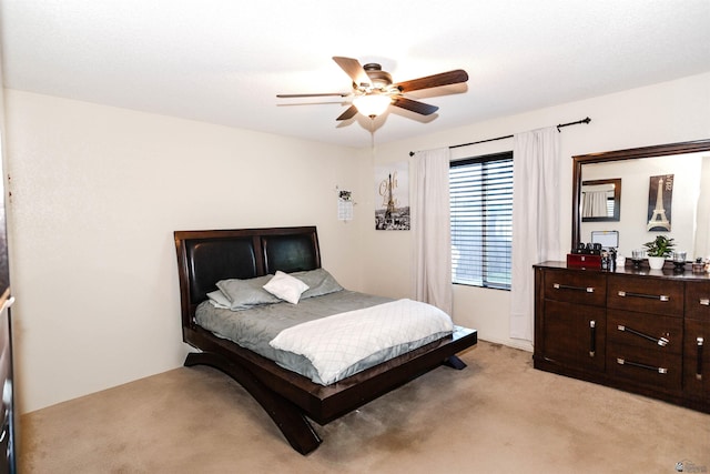 bedroom with light carpet and ceiling fan