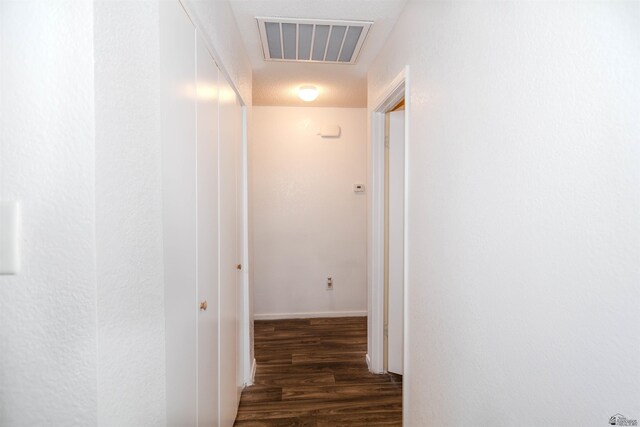 hall with wood finished floors