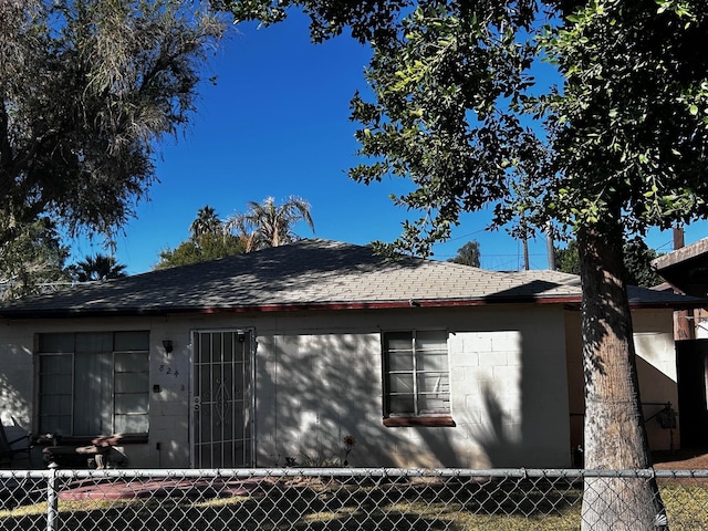 826 S 20th Ave, Yuma, AZ 85354 - view of home's exterior featuring fence and roof with shingles