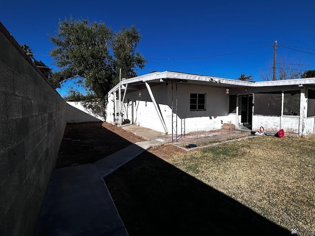 826 S 20th Ave, Yuma, AZ 85354 - view of home's exterior with fence and concrete block siding