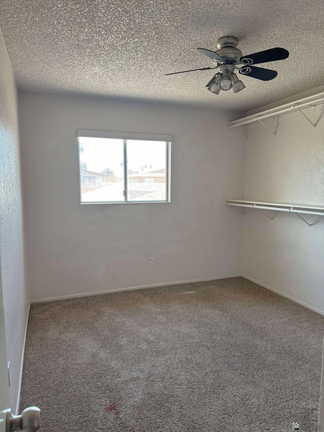 1234 W 20th Pl, Yuma, AZ 85364 - carpeted spare room with a textured ceiling and ceiling fan