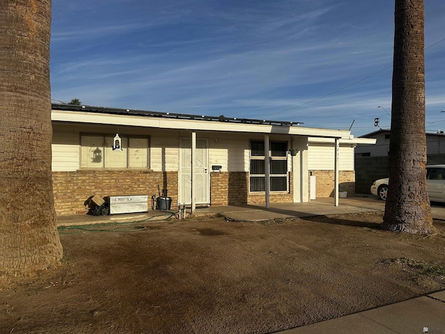 exterior space with brick siding