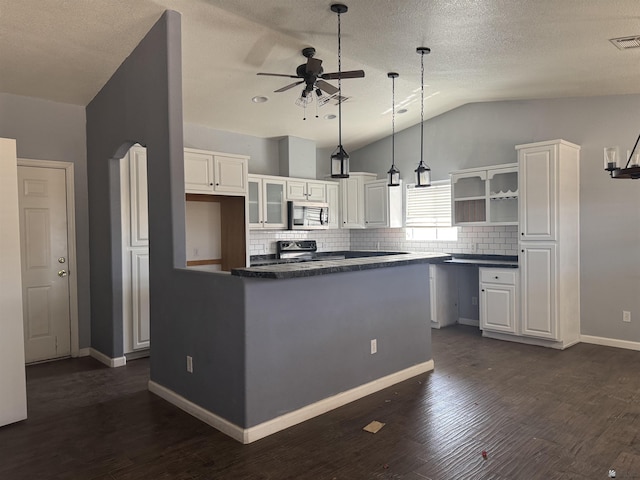 10310 E 37th Pl, Yuma, AZ 85365 - kitchen with stainless steel microwave, electric range oven, open shelves, ceiling fan, and dark countertops