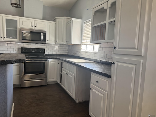 10310 E 37th Pl, Yuma, AZ 85365 - kitchen with appliances with stainless steel finishes, white cabinets, decorative backsplash, glass insert cabinets, and dark wood finished floors
